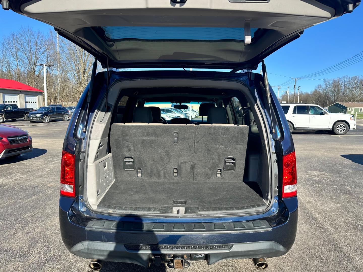 2015 Blue /Tan Honda Pilot EX-L (5FNYF4H73FB) with an 3.5L V6 engine, 5-Speed Automatic transmission, located at 547 E. Main St., Orwell, OH, 44076, (440) 437-5893, 41.535435, -80.847855 - Photo#39